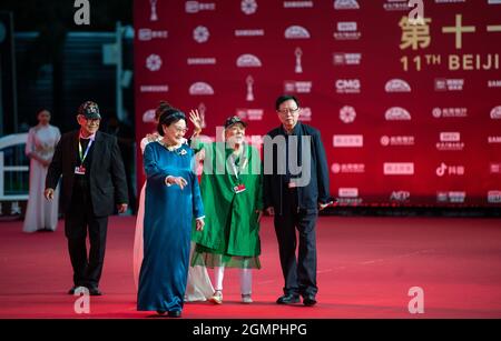 Beijing, China. 20th Sep, 2021. Artists Wang Xiaotang (front) and Xie Fang (2nd R) walk on the red carpet for the 11th Beijing International Film Festival in Beijing, capital of China, Sept. 20, 2021. Credit: Chen Zhonghao/Xinhua/Alamy Live News Stock Photo