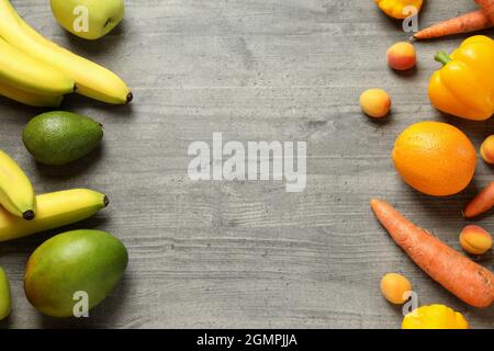 Set of different vegetables and fruits on gray textured background Stock Photo