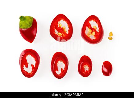 Set of raw red hot chili pepper slices with seeds isolated on a white background. High quality macro of chopped ornamental pepper mini pod. Stock Photo