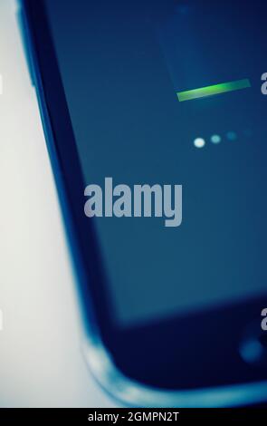 Close-up of a mobile phone being charged Stock Photo