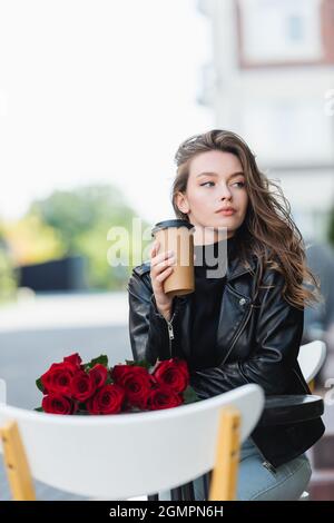 black leather jacket with red roses