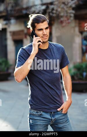 young top model man using smartphone Stock Photo