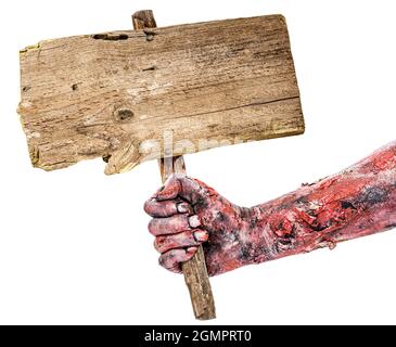 zombie hand holding sign with space for text, isolated white background, copyspace, halloween hand. Stock Photo