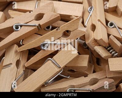 close up of a heap from wooden clothespins isolated on white background Stock Photo