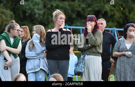 Members of the public attend a vigil at the scene in Chandos Crescent, Killamarsh, near Sheffield, where four people were found dead at a house on Sunday. Picture date: Monday September 20, 2021. Stock Photo