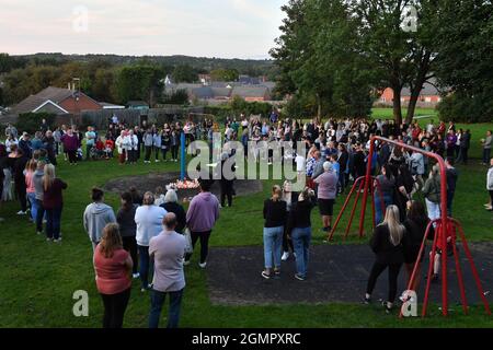 Members of the public attend a vigil near to the scene in Chandos Crescent, Killamarsh, near Sheffield, where four people were found dead at a house on Sunday. Picture date: Monday September 20, 2021. Stock Photo
