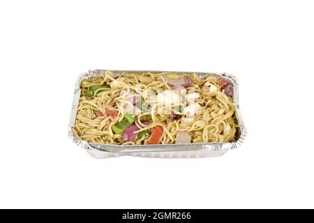 Chow Mein in foil tray isolated on white background with clipping path Stock Photo