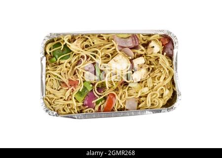 Top view of veg noodles in a foil tray isolated on a white background with clipping path,  take away meal Stock Photo