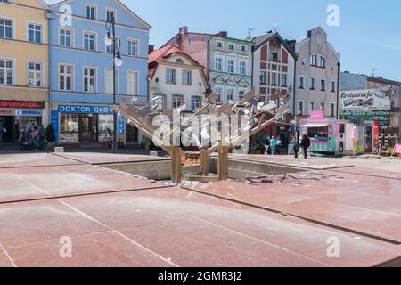 Bytow, Poland - May 31, 2021: Water fountain on market square in Bytow. Stock Photo
