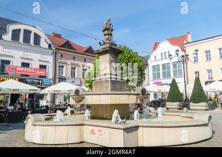 Rybnik, Poland - June 4, 2021: Water fountain with sculpture of John of Nepomuk (or John Nepomucene) at market square in Rybnik. Stock Photo