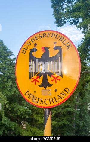 Gorlitz, Germany - June 2, 2021: Emblem of Germany with sign Bundesrepublik Deutschland with eagle. Stock Photo