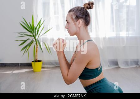Portret of Young sporty attractive woman practicing yoga, working out Stock Photo