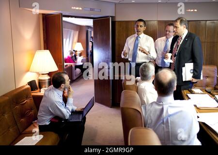 President Barack Obama meets with staff aboard Air Force One during their flight April 3, 2009, from Stansted Airport in Essex, England, en route to Strasbourg, France.. Official White House Photo by Pete Souza Stock Photo