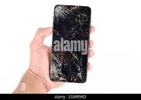 Hand Holding Broken Screen Smartphone Isolated on White Background with Clipping Path Stock Photo