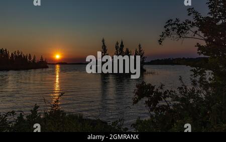 The sun setting over the Chippewa Flowage in northern Wisconsin. Stock Photo