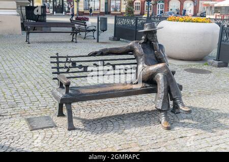 Swiebodzin, Poland - June 1, 2021: Czeslaw Niemen's bench in old town of Swiebodzin. Stock Photo