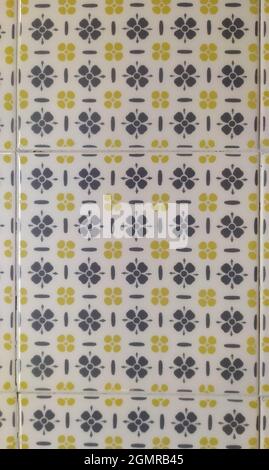 Square Ceramic Tile with Gray and Yellow Floral Patterns Stock Photo