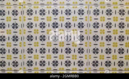 Square Ceramic Tile with Gray and Yellow Floral Patterns Stock Photo