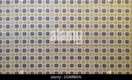 Square Ceramic Tile with Gray and Yellow Floral Patterns Stock Photo