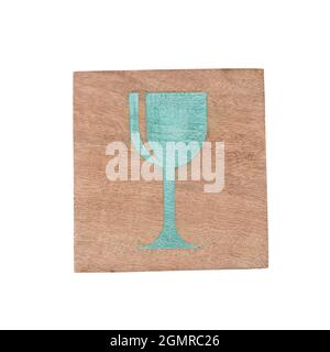 Glass sign printed on wooden coaster isolated on white background with clipping path Stock Photo