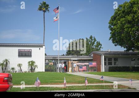 Small American flags are places around signage at Back Bay and Monte Vista High School, Tuesday, Aug. 31, 2021, in Costa Mesa, Calif. The flags were p Stock Photo