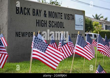 Small American flags are places around signage at Back Bay and Monte Vista High School, Tuesday, Aug. 31, 2021, in Costa Mesa, Calif. The flags were p Stock Photo