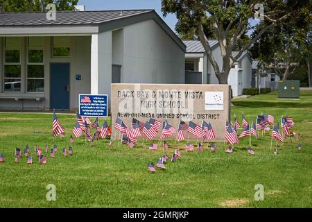 Small American flags are places around signage at Back Bay and Monte Vista High School, Tuesday, Aug. 31, 2021, in Costa Mesa, Calif. The flags were p Stock Photo