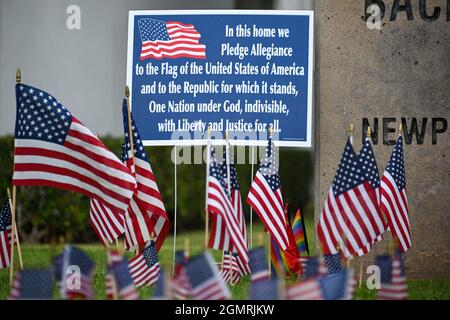 Small American flags are places around signage at Back Bay and Monte Vista High School, Tuesday, Aug. 31, 2021, in Costa Mesa, Calif. The flags were p Stock Photo