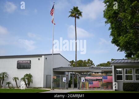 Small American flags are places around signage at Back Bay and Monte Vista High School, Tuesday, Aug. 31, 2021, in Costa Mesa, Calif. The flags were p Stock Photo