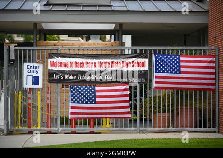 Small American flags are places around signage at Back Bay and Monte Vista High School, Tuesday, Aug. 31, 2021, in Costa Mesa, Calif. The flags were p Stock Photo