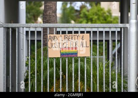 Small American flags are places around signage at Back Bay and Monte Vista High School, Tuesday, Aug. 31, 2021, in Costa Mesa, Calif. The flags were p Stock Photo