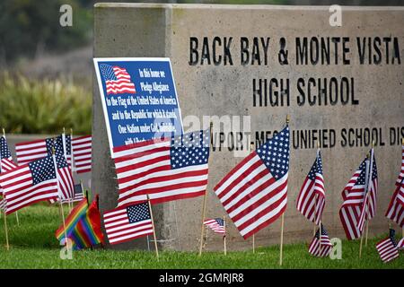 Small American flags are places around signage at Back Bay and Monte Vista High School, Tuesday, Aug. 31, 2021, in Costa Mesa, Calif. The flags were p Stock Photo