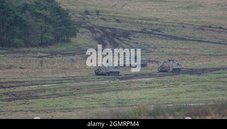 British army Warrior FV512 MRV & Warrior FV510 IFV tanks in action on a military exercise, Salisbury Plain, Wilts UK Stock Photo