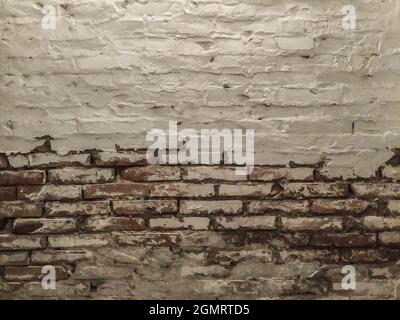 Old brick wall deteriorated by moisture, Parma Italy Stock Photo