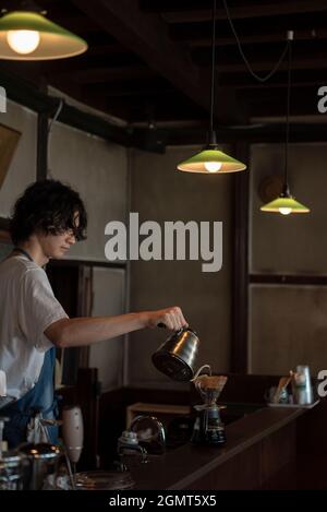 Man Has Put a Drip Coffee at Japanese style Cafe Stock Photo