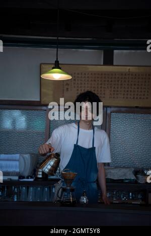 Man Has Put a Drip Coffee at Japanese style Cafe Stock Photo