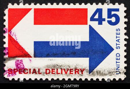 USA - CIRCA 1983: a stamp printed in the USA shows Arrows, Special Delivery, hand to hand, circa 1954 Stock Photo