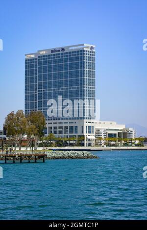A view across the San Diego Bay of the South Embarcadero Park and the Hilton  San Diego Bayfront Hotel across from the Coronado Bridge in San Diego, CA  Stock Photo - Alamy