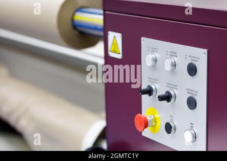 Control panel of the roll to roll calender machine for transfer printing on fabric. Selective focus. Stock Photo