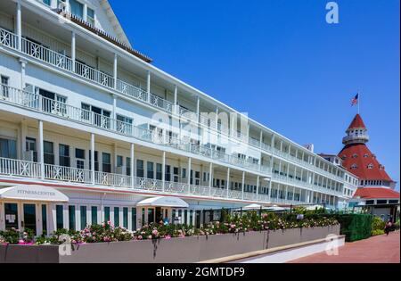 The Hotel Del Coronado with the illustrious past retains iconic Queen Anne-style architecture with red turrets since 1888 in Coronado, San Diego, CA Stock Photo