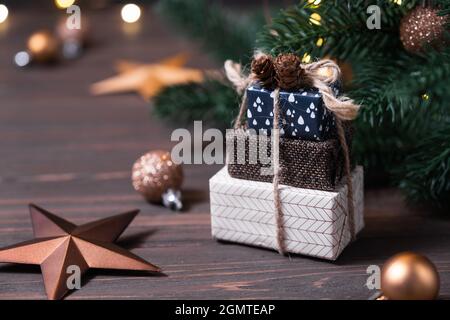 Christmas arrangement with gift boxes, Christmas decorations and pine branches. Stock Photo