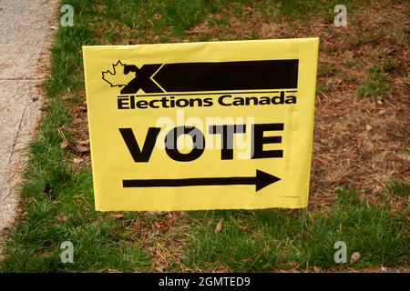 VANCOUVER, BC, CANADA. 20 Sept. 2021 -- An Elections Canada sign points the way to a polling station during the Canadian federal election, Stock Photo