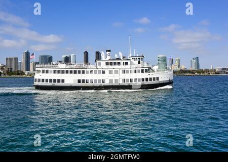 The multi decked Admiral Hornblower ship utilized for San Diego Bay  sightseeing tours & special events cruises by the skyline of San Diego, CA Stock Photo