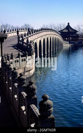 Beijing, China - March 1982      The 150 meter long 17-Arch Bridge was built in 1750 by the Qing emperor QianLong. It links the eastern edge of Kunmin Stock Photo