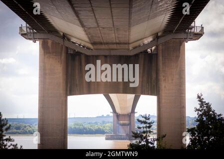 The Humber Bridge, near Kingston upon Hull, East Riding of Yorkshire, England, is a 2.22 km (2,430 yd; 7,300 ft; 1.38 mi) single-span road suspension bridge, which opened to traffic on 24 June 1981. When it opened, the bridge was the longest of its type in the world; it was not surpassed until 1998, with the completion of the Akashi Kaikyō Bridge, and is now the eleventh-longest. It is still the second-longest span in the Western Hemisphere.  The bridge spans the Humber (an estuary formed by the rivers Trent and Ouse), between Barton-upon-Humber on the south bank and Hessle on the north bank. Stock Photo