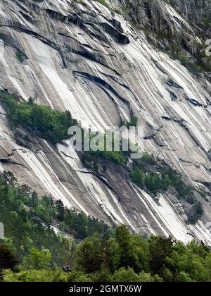 Eidfjord is a small town in Hardanger District, on the west coast of Norway. It is situated at the end of the Eidfjorden, an inner branch of the large Stock Photo