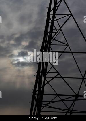 Oxfordshire, England - 31 March 2020; no people in view.    I love electricity pylons; I find their abstract, gaunt shapes endlessly fascinating. Here Stock Photo