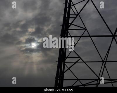 Oxfordshire, England - 31 March 2020; no people in view.    I love electricity pylons; I find their abstract, gaunt shapes endlessly fascinating. Here Stock Photo