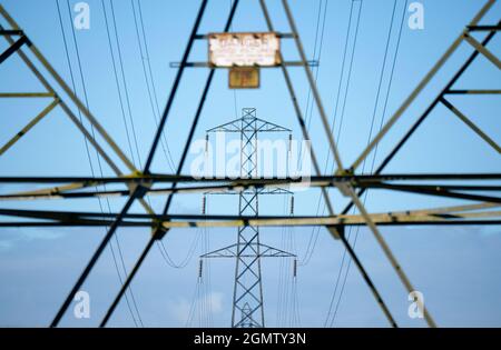 Oxfordshire, England - 28 July 2020; no people in view.    I love electricity pylons; I find their abstract, gaunt shapes endlessly fascinating. Here Stock Photo