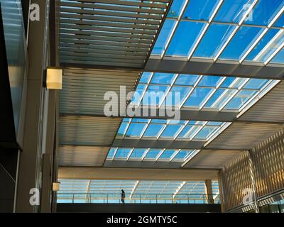Oxford, England - 18 April 2018; one man on a walkway. Westgate is a new shopping area in Oxford City Centre, England. Opened in  October 2017, it is Stock Photo